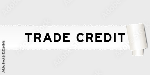 Ripped gray paper background that have word trade credit under torn part