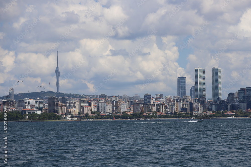 city skyline with sailboat