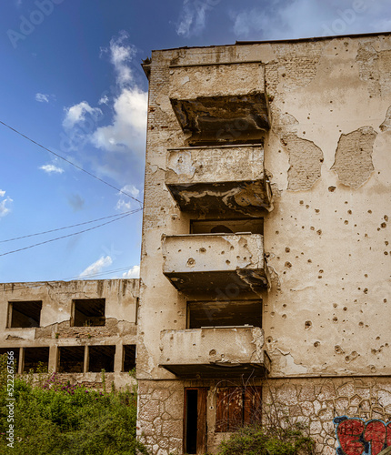 Sarajevo, Bosnia - May 2, 2022 - Bullet ridden buildings from The Bosnian War.