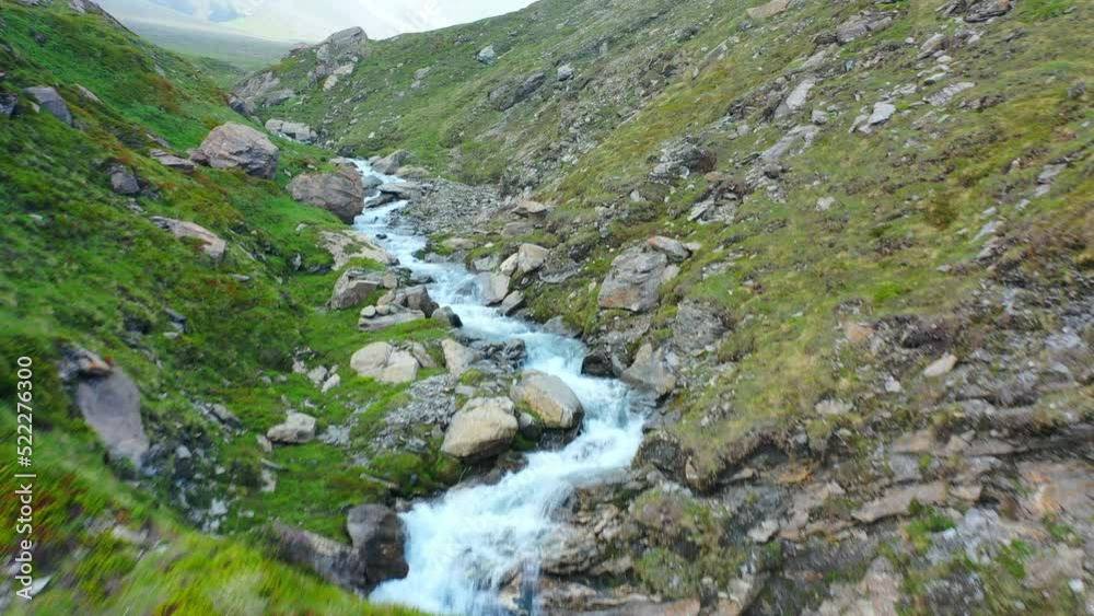 Aerial Forward Shot Of River Flowing In Stream On Hills - Val-Cenis, France Aerial Forward Shot Of River Flowing In Stream On Hills - Val-Cenis, France