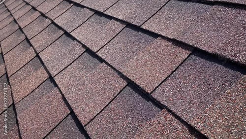 Close shot of bituminous tiles roofing on very hot photo