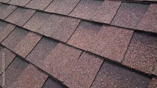 Closeup of brown bitumen roof shingles photo