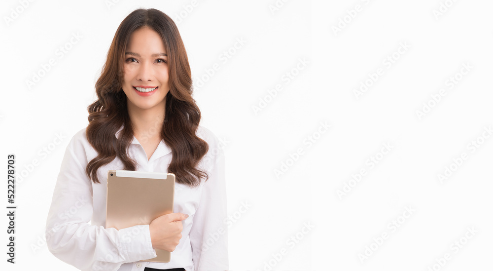 Asian business woman, long hair, wearing a white shirt, holding a tablet, standing on a white background. Asian business woman, long hair, wearing a white shirt, holding a tablet, standing on a white background.