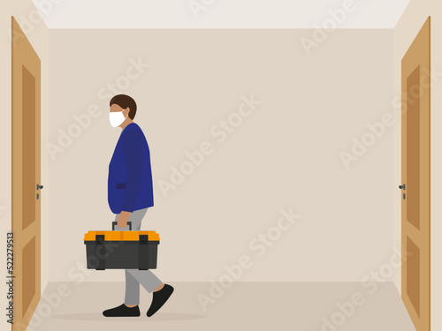 A man in a medical mask and with a tool box in his hand stands in front of a closed door