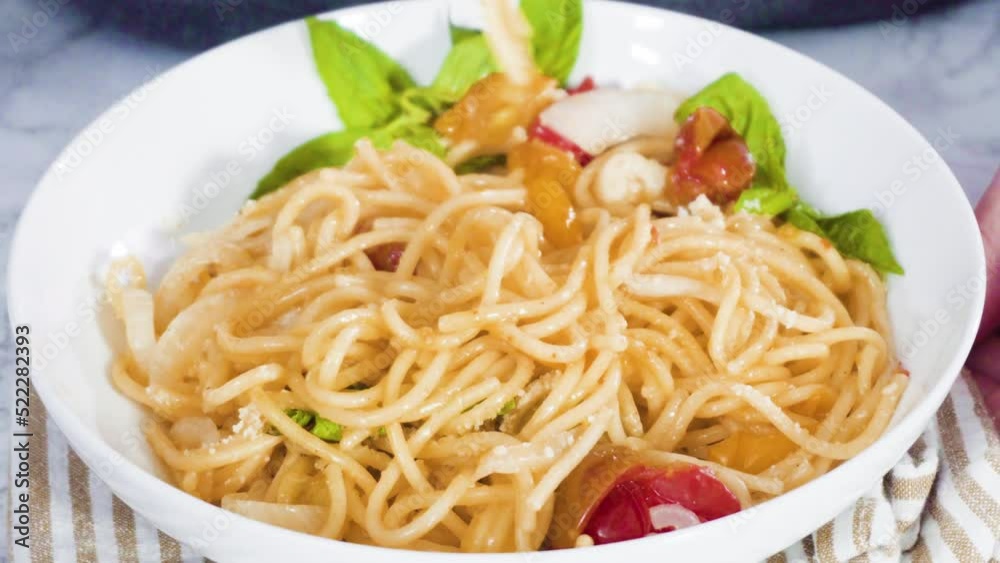 Step by step. Serving a one-pot pasta into a white pasta plate. Step by step. Serving a one-pot pasta into a white pasta plate.