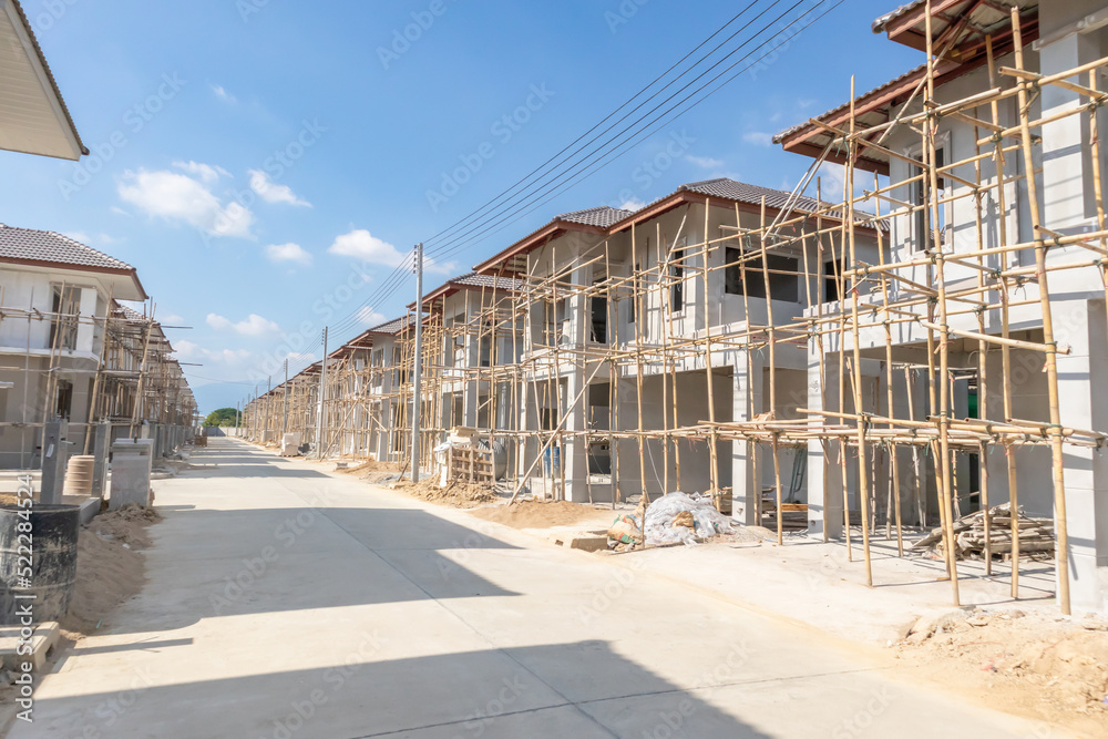 Obraz premium construction residential new house in progress at building site housing estate development