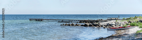 kayaks and pier on Koge bay shore, Stroby Egede, Denmark