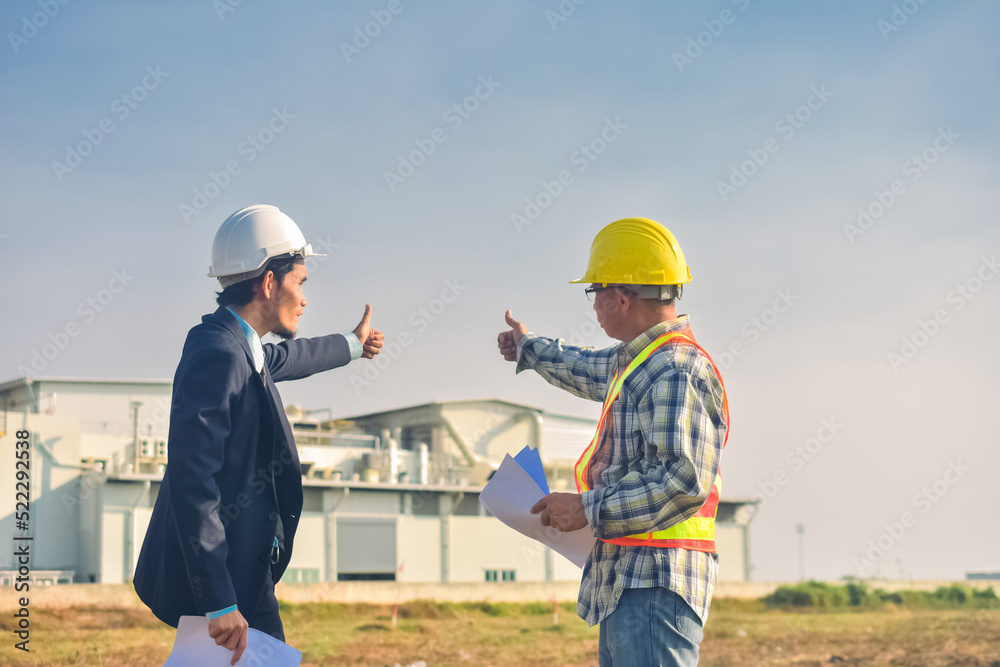 Asian engineer construction team checking work for control and management in the construction site or building site Asian engineer construction team checking work for control and management in the construction site or building site
