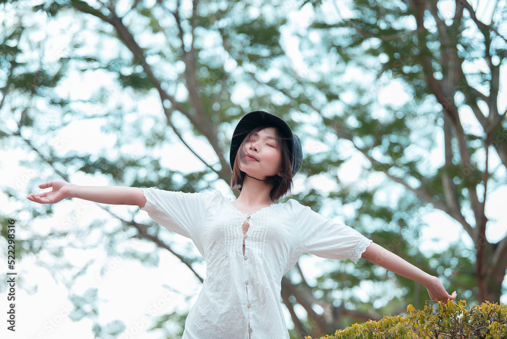 Portrait of beautiful young asian woman wear white dress outdoor,Lifestyle of modern woman Portrait of beautiful young asian woman wear white dress outdoor,Lifestyle of modern woman