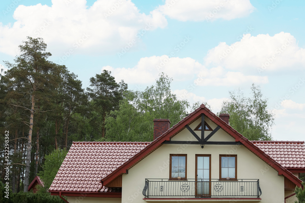 Modern building with red roof outdoors on spring day Modern building with red roof outdoors on spring day