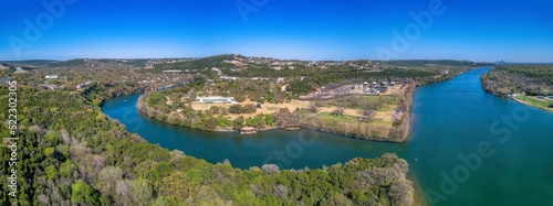 Panoramic view of the Colorado River in between the land of Austin, Texas #522302305
