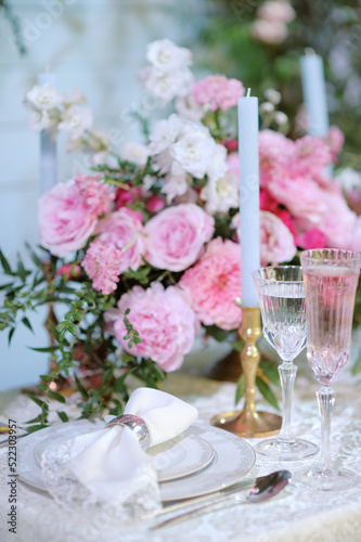 Stylish table set for an event party or wedding reception banquet. Beautiful and luxury decoration of table in restaurant