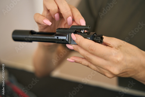 Detail of firearms in young female hands