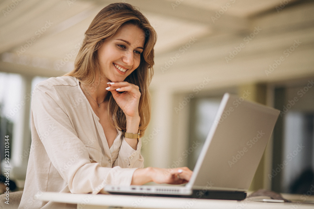 Portrait of a business woman working on laptop Portrait of a business woman working on laptop
