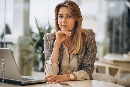 Portrait of a business woman working on laptop