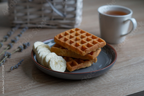 A plate of Belgian waffles on the table
