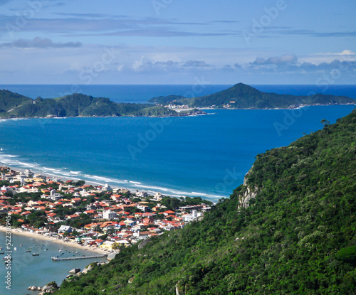 View from Morro do Macaco of Canto Grande and Mariscal Beach. Beautiful sunny day in Bombinhas, Santa Catarina state, Brazil photo