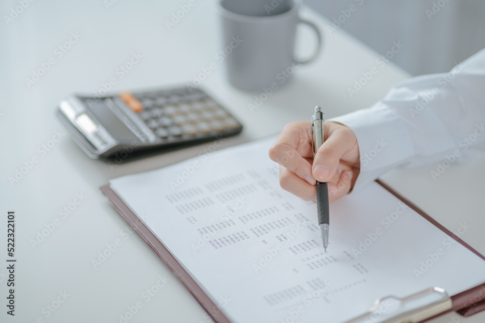 Asian business woman Hand writing ideas And taking notes Asian business woman Hand writing ideas And taking notes