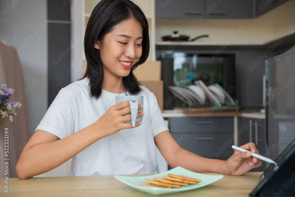 Asian girl enjoy eating at home in the morning, Lifestyle concept.. Asian girl enjoy eating at home in the morning, Lifestyle concept..