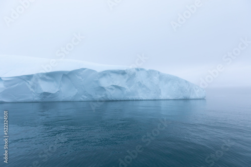 Climate change and global warming. Icebergs from a melting glacier in Ilulissat Glacier  Greenland. The icy landscape of the Arctic nature in the UNESCO world heritage site.