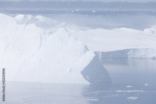 Climate change and global warming. Icebergs from a melting glacier in Ilulissat Glacier, Greenland. The icy landscape of the Arctic nature in the UNESCO world heritage site. © Michal