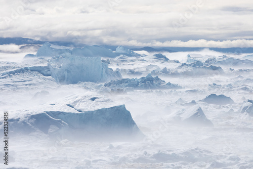 Climate change and global warming. Icebergs from a melting glacier in Ilulissat Glacier, Greenland. The icy landscape of the Arctic nature in the UNESCO world heritage site. © Michal