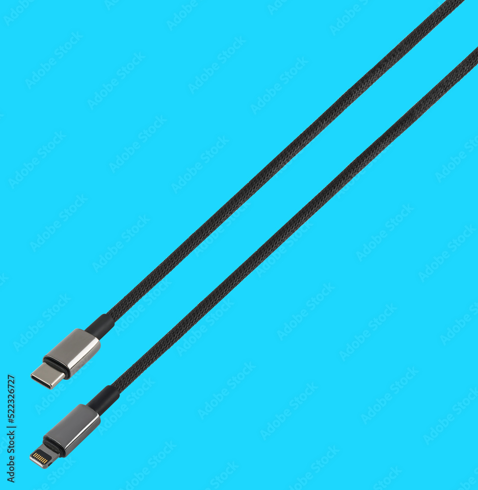 cable with USB and Lightning connector, on a blue background cable with USB and Lightning connector, on a blue background