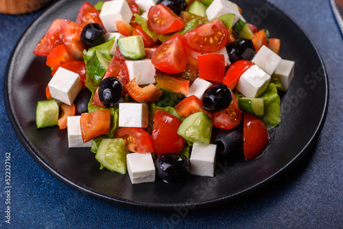 Greek salad with fresh vegetables, feta cheese and black olives