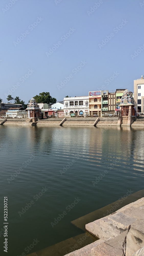 Commerce and worship coexist in Kumbakonam, Pond surrounded by temples in Kumbakonam, Tamil Nadu, India