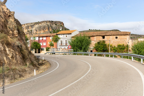 a paved road entering Nuévalos town, province of Zaragoza, Aragon, Spain