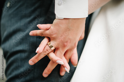 The bride and groom holding hands. Engagement. Bottom view. Newlyweds of the outdoors. Close up.