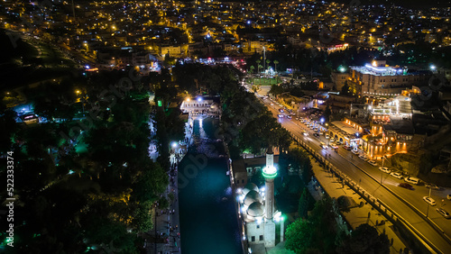 Aerial view of Balikligol, Rizvaniye Mosque and city lights in the night time. Most popular and visited places for devotees and tourists in Sanliurfa, Turkey photo