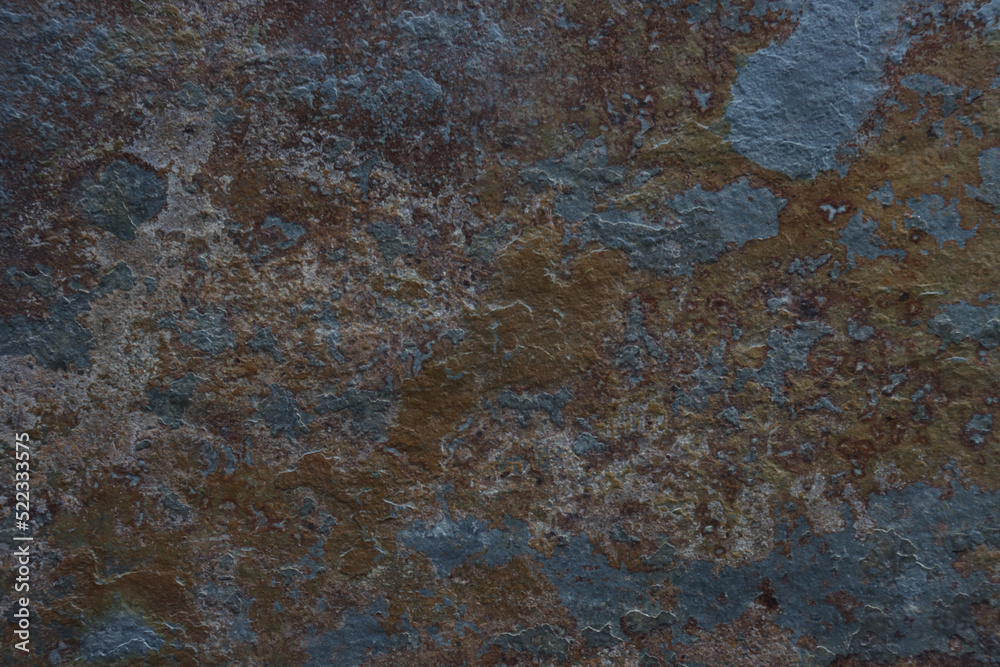 Old cracked painted textured brown background with blue spots. Old cracked painted textured brown background with blue spots.