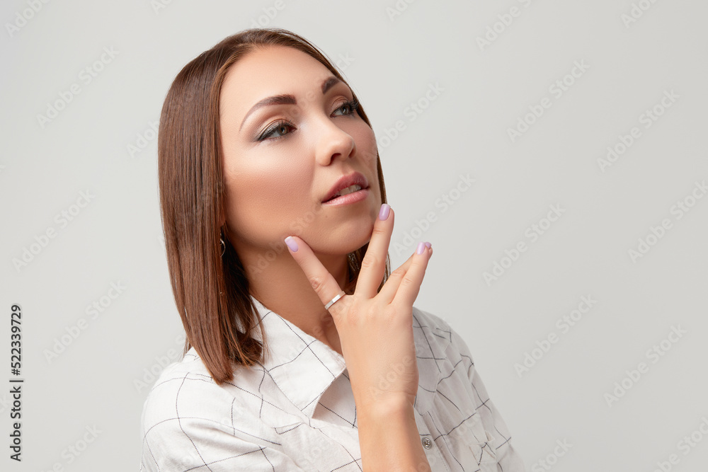 Beautiful woman in casual clothes posing over white background Beautiful woman in casual clothes posing over white background