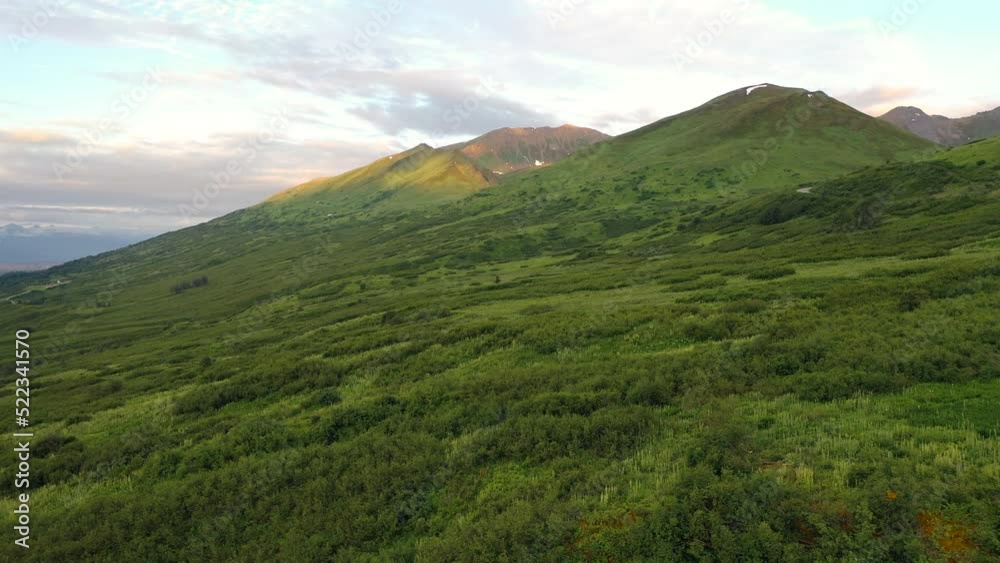 Aerial view of Hatcher Pass, Alaska. Mountain Pass pass through the Talkeetna Mountains from above. Summer Alaskan landscape Aerial view of Hatcher Pass, Alaska. Mountain Pass pass through the Talkeetna Mountains from above. Summer Alaskan landscape