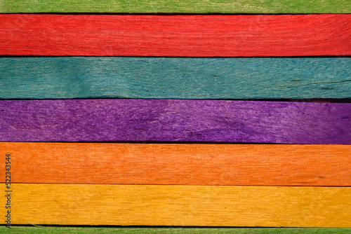 Multicolored wooden background from popsicle sticks.