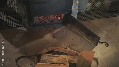 Sugar shack house with wood fire pan stove and iron kettle evaporator concentrating and evaporating for production of maple syrup in Highland country, Virginia photo