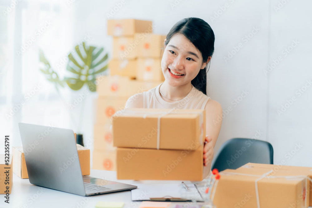 Asian teenager owner business woman work at home for online shopping and sale Asian teenager owner business woman work at home for online shopping and sale