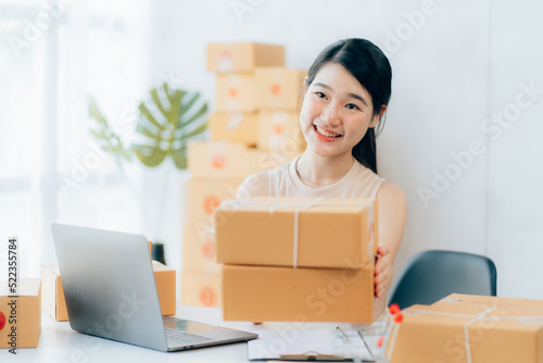 Asian teenager owner business woman work at home for online shopping and sale © Kritdanai