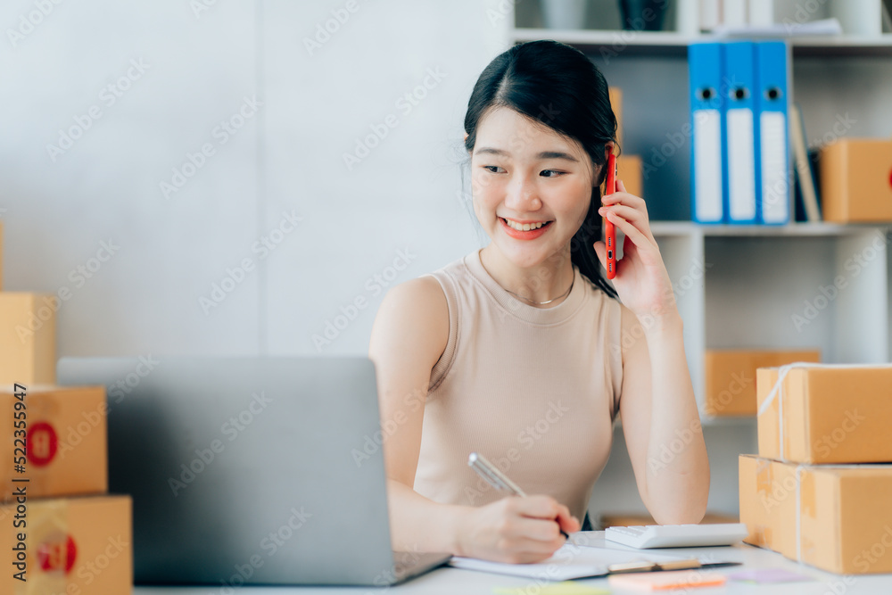 Asian teenager owner business woman work at home for online shopping and sale Asian teenager owner business woman work at home for online shopping and sale