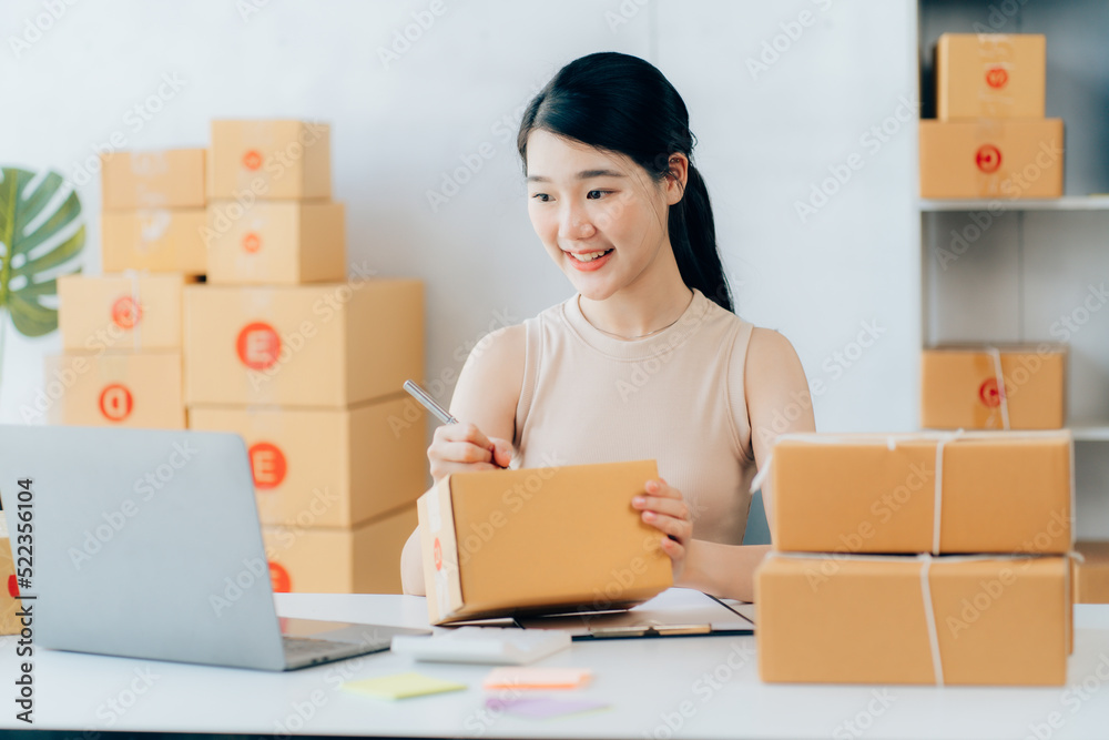 Asian teenager owner business woman work at home for online shopping and sale Asian teenager owner business woman work at home for online shopping and sale