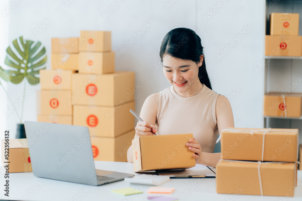 Asian teenager owner business woman work at home for online shopping and sale Asian teenager owner business woman work at home for online shopping and sale