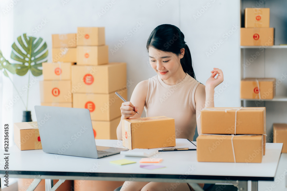 Asian teenager owner business woman work at home for online shopping and sale Asian teenager owner business woman work at home for online shopping and sale