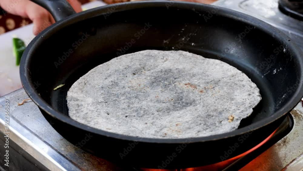 Cooking chicken taco series Street food vendor grilling and flipping a