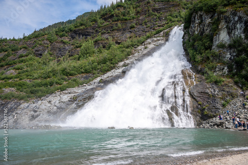 Views of the Nugget Falls the pours into the glacial lake at Mendenhall glacier.