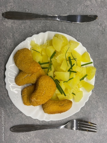 Chicken nuggets and potatoes