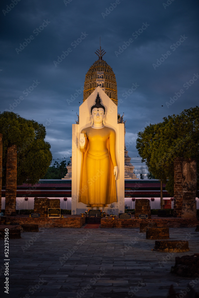 Fototapeta premium Standing Buddha image the landmark in Phitsanulok Province, Thailand.