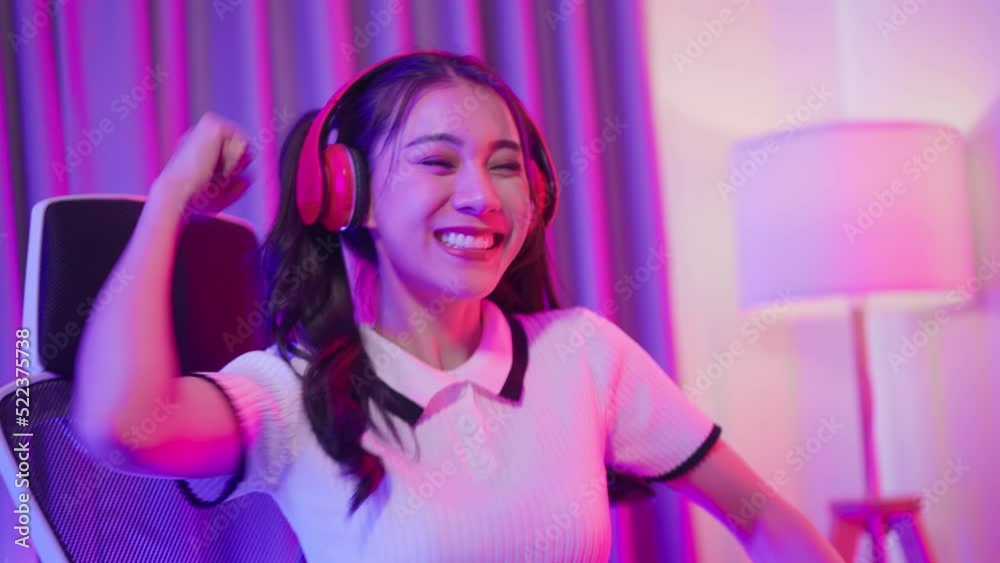 Asian beautiful Esport woman gamer play online video game on computer.