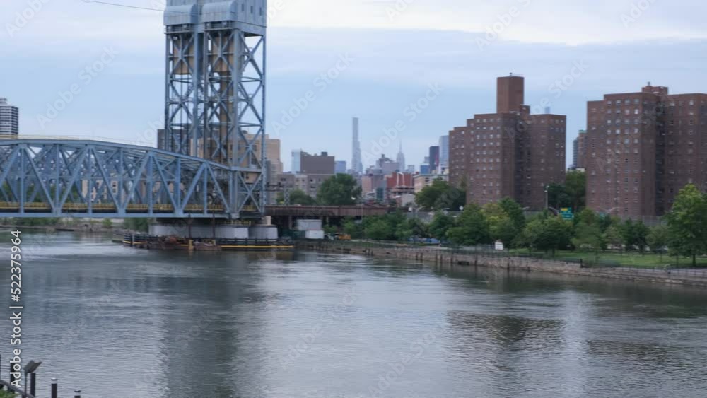 Fast cinematic steadycam ground shot pan across the Park Avenue Bridge on the Harlem River in NYC Fast cinematic steadycam ground shot pan across the Park Avenue Bridge on the Harlem River in NYC