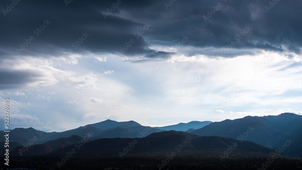 rain clouds over the rocky mountains